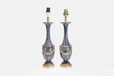 Lot 518 - A pair of Louis XVI-style ceramic and gilt-metal-mounted table lamps