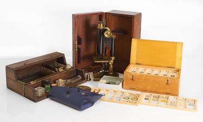 Lot 330 - A boxed R & J London microscope