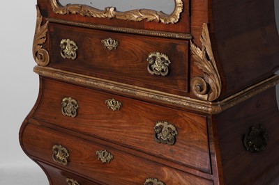 Lot A rococo kingwood and parcel-gilt bureau cabinet in the manner of Matthias Ortmann