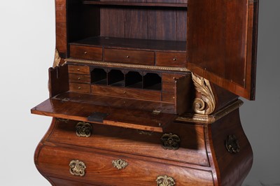 Lot A rococo kingwood and parcel-gilt bureau cabinet in the manner of Matthias Ortmann