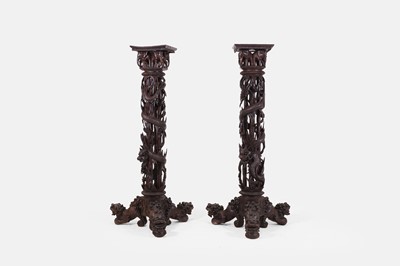 Lot 599 - A pair of hardwood jardinière stands