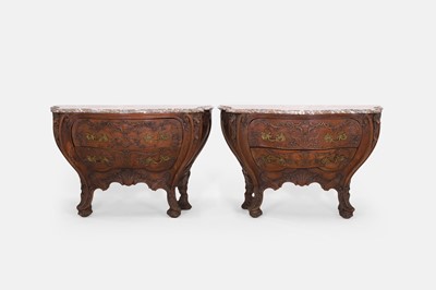 Lot 50 - A pair of rococo oak and marble bombé commodes