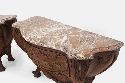 Lot 50 - A pair of rococo oak and marble bombé commodes