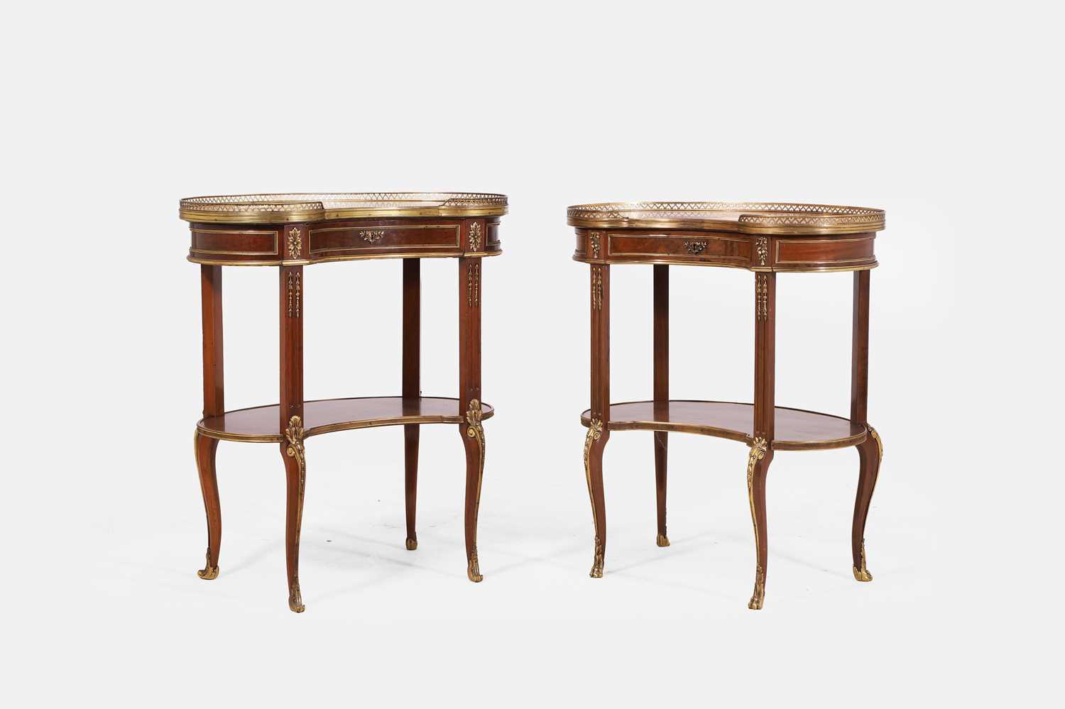 Lot 587 - A pair of Louis XVI-style mahogany and ormolu side tables