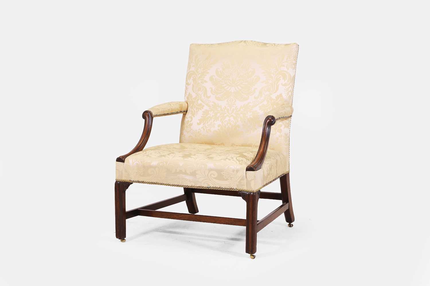 Lot 73 - A George III mahogany Gainsborough library armchair