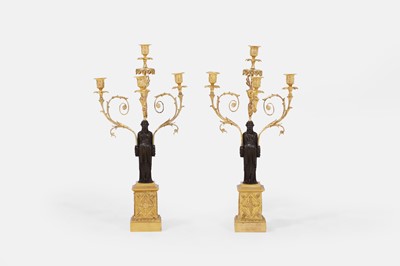 Lot 66 - A pair of large Regency patinated and gilt-bronze figural candelabra