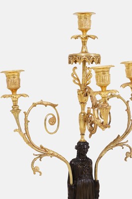 Lot 66 - A pair of large Regency patinated and gilt-bronze figural candelabra