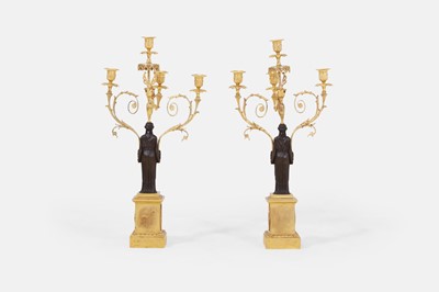 Lot 66 - A pair of large Regency patinated and gilt-bronze figural candelabra