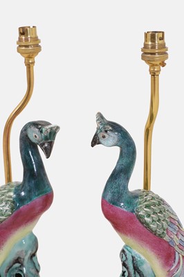 Lot 39 - A pair of export famille rose porcelain 'peacock' lamps
