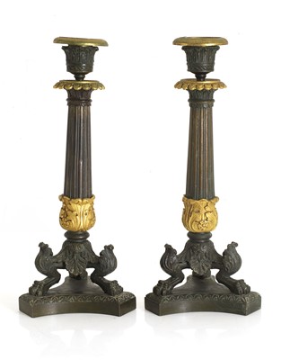 Lot 331 - A pair of bronze and ormolu candlesticks