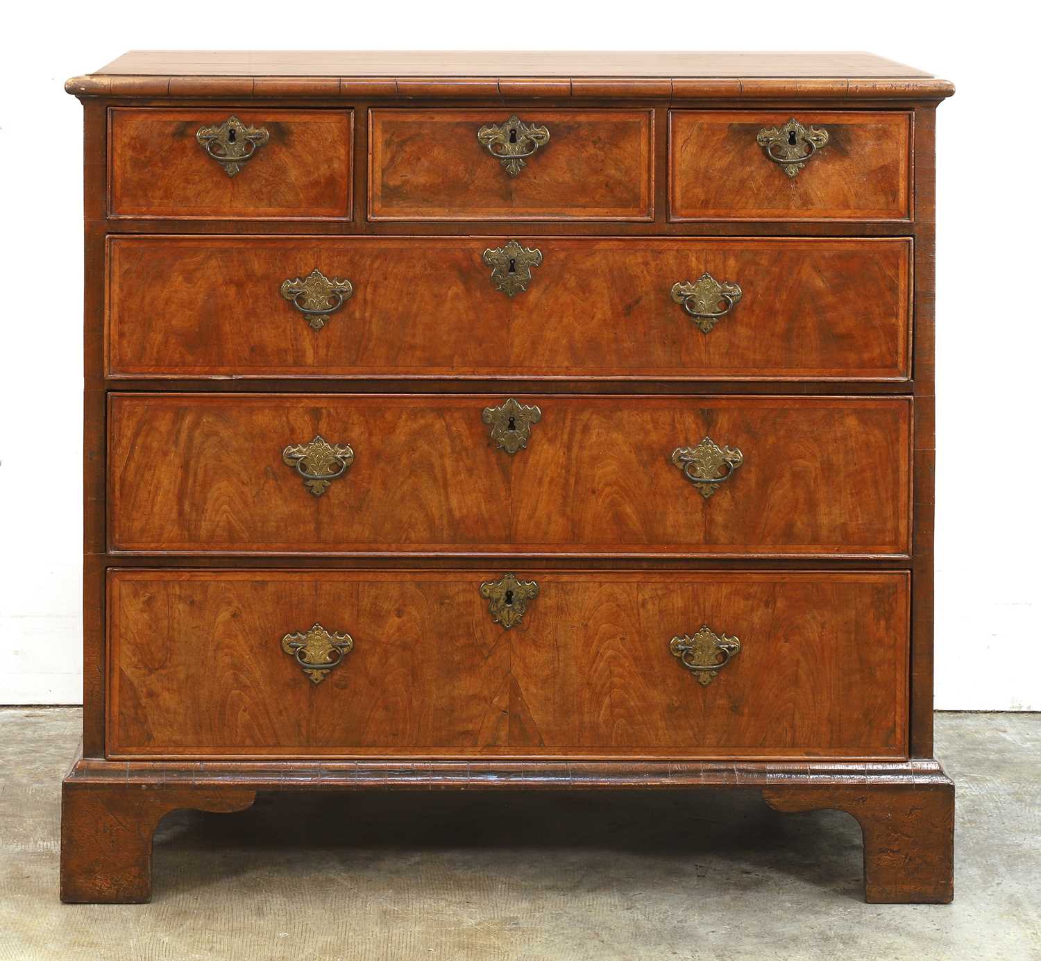 Lot 549 - A walnut chest of drawers