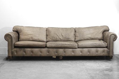 Lot 504 - A large grey leather upholstered chesterfield sofa