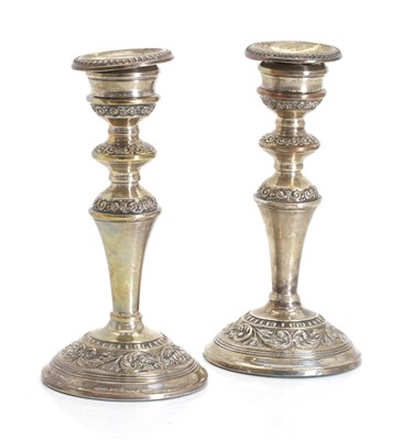 Lot 13 - A pair of silver candlesticks