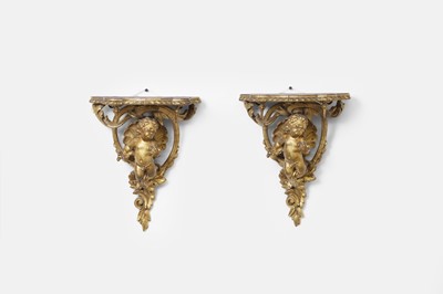 Lot 489 - A pair of giltwood cherub wall brackets