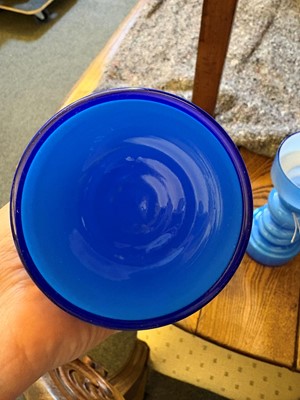 Lot 155 - A pair of blue glass vases