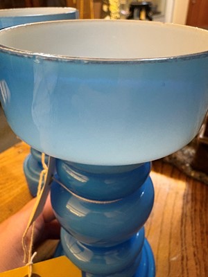 Lot 155 - A pair of blue glass vases