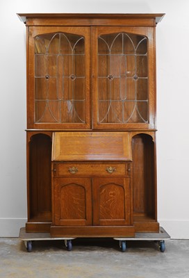 Lot 533 - An Arts and Crafts oak bureau cabinet