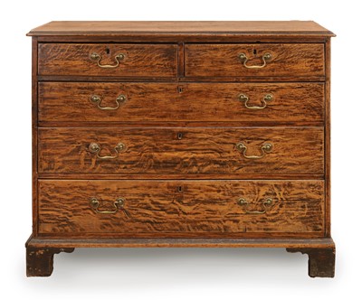 Lot 504 - A George III 'tiger' oak chest of drawers