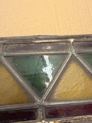 Lot 157 - A pair of Arts and Crafts stained glass panels