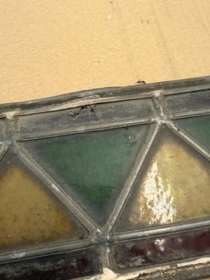 Lot 157 - A pair of Arts and Crafts stained glass panels