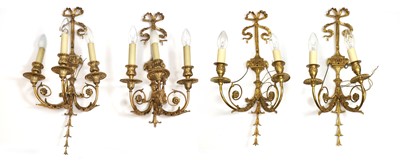 Lot 489A - A set of four gilt metal wall appliques