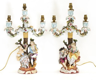 Lot 125 - A pair of Dresden porcelain figural candelabra