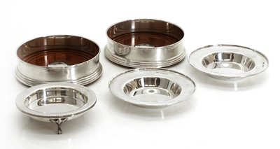 Lot 9 - A collection of silver pin dishes and coasters