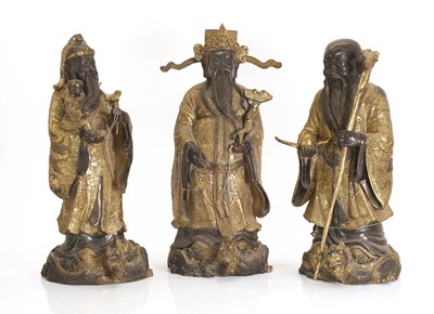 Lot 72 - Three Chinese gilt-brass figures of of 'Lu', 'Fu' and 'Shou'
