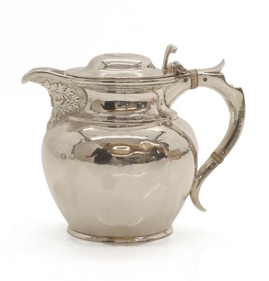 Lot 27 - A silver lidded masked jug