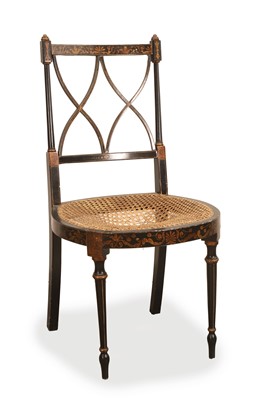 Lot 503 - A late Regency style ebonised and parcel gilt cane chair