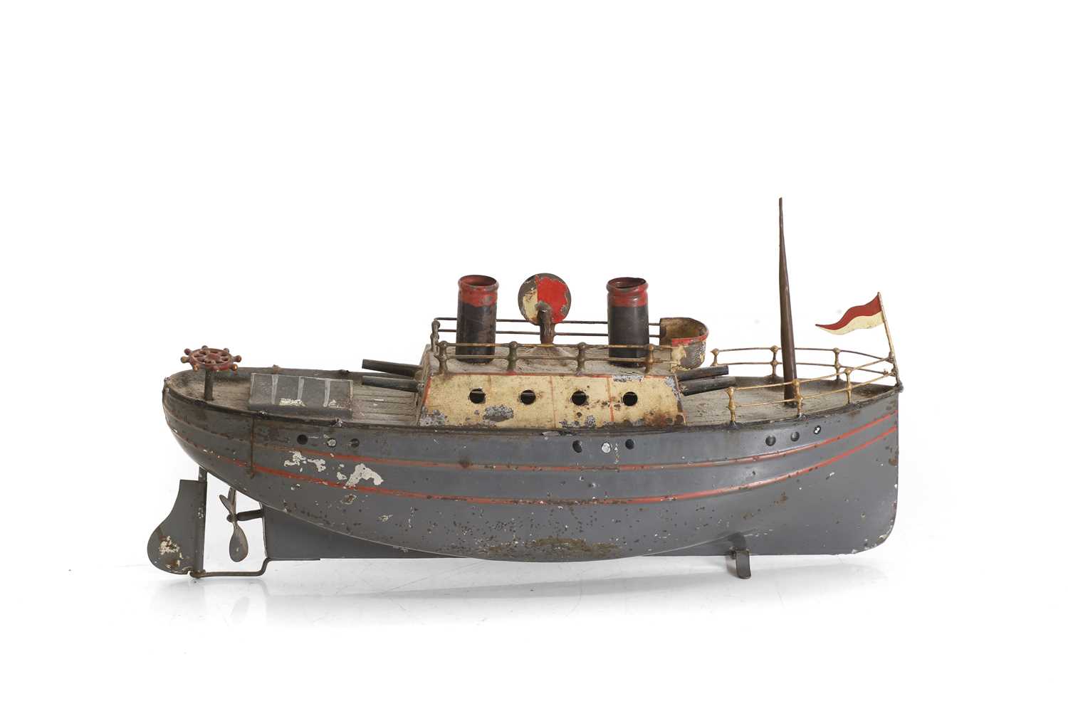 Lot 31 - A tin model gunboat with twin chimneys