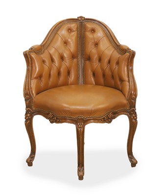 Lot 577 - A walnut and leather button-back chair