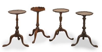 Lot 590 - A collection of four mahogany tripod wine tables