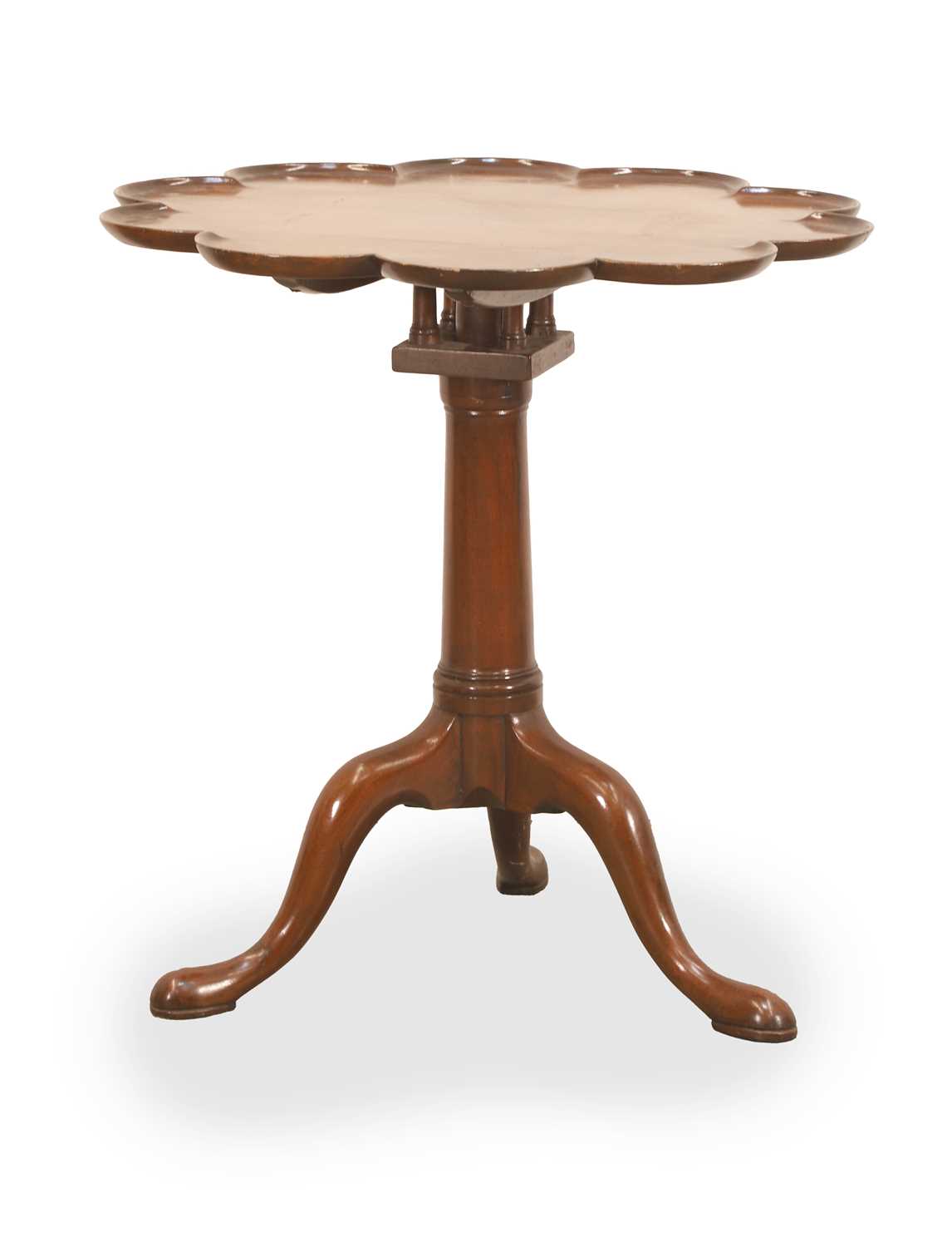 Lot 543 - A tilt top wine table with a piecrust top