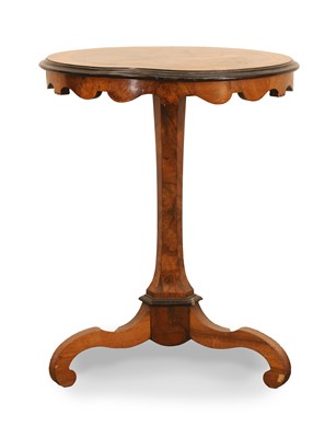 Lot 556 - A walnut tripod table
