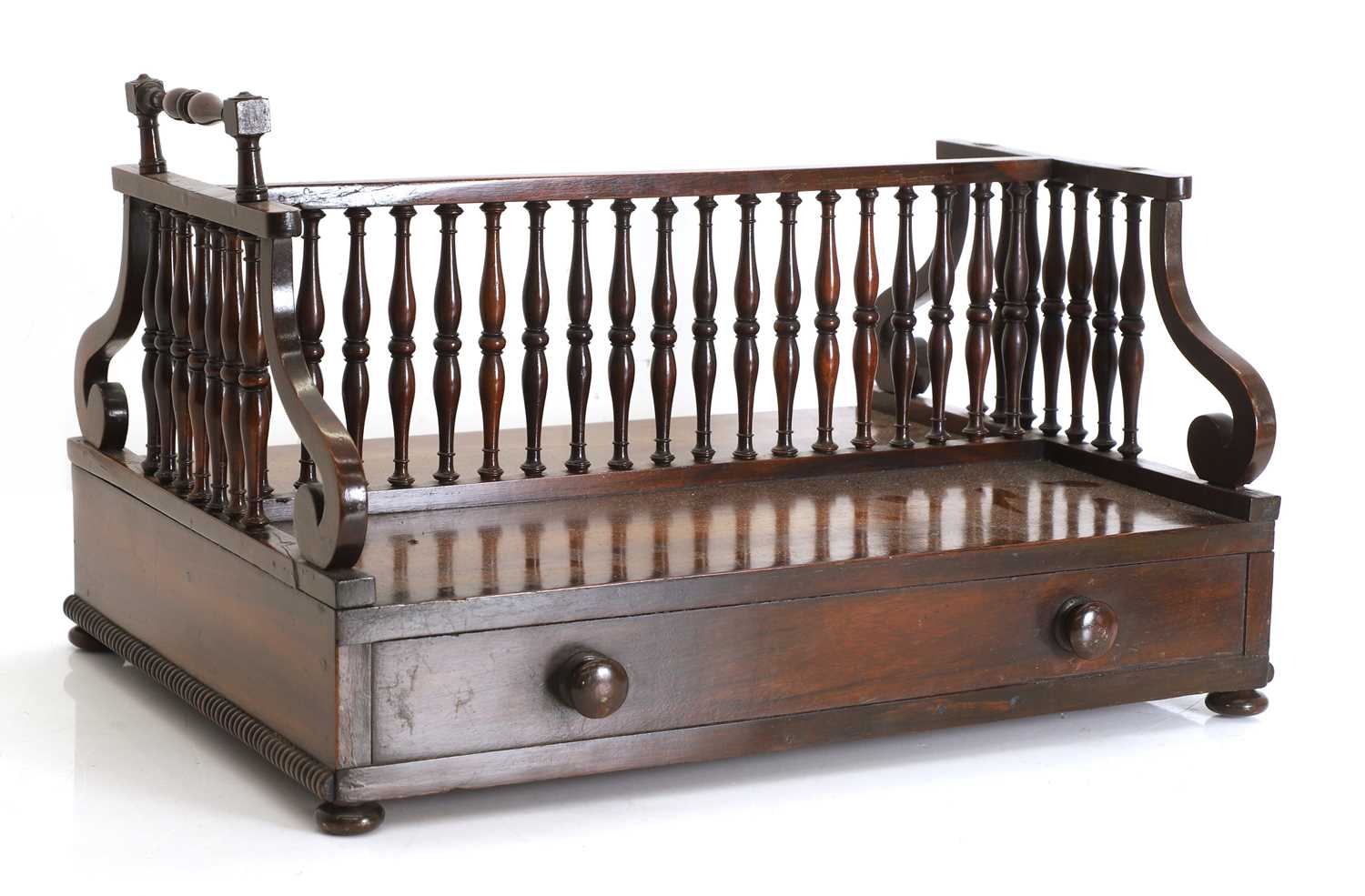 Lot 528 - A Regency rosewood double sided book trough