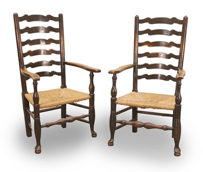 Lot 504 - Two Lancashire oak ladderback elbow armchairs