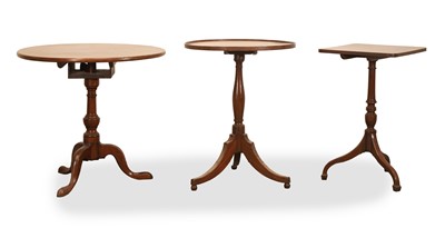 Lot 555 - Two tilt top mahogany wine tables