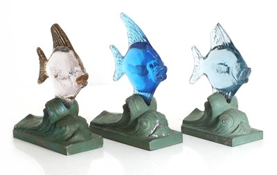 Lot 151 - A set of three Art Deco glass and spelter paperweights
