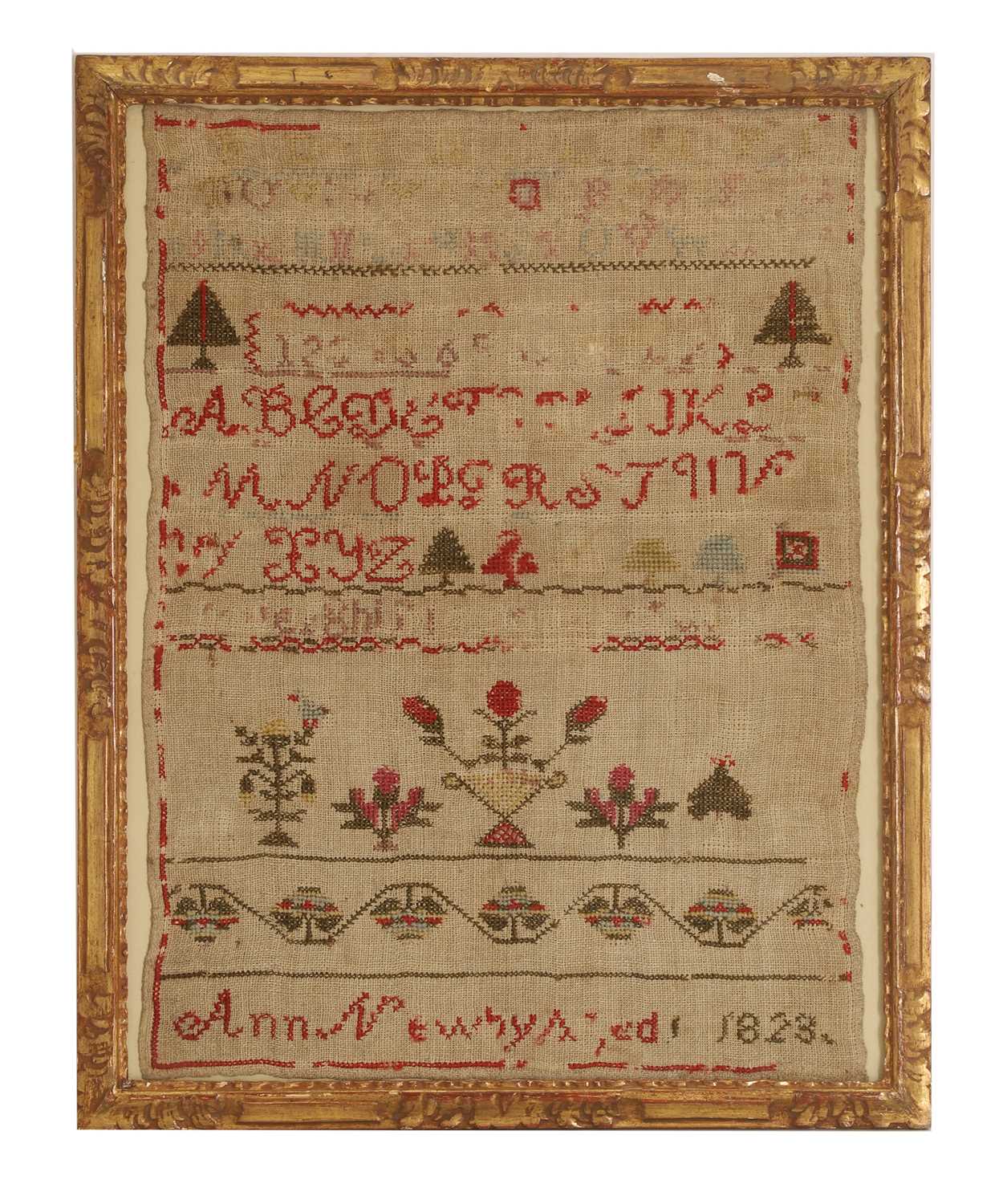 Lot 301 - An small needlework sampler