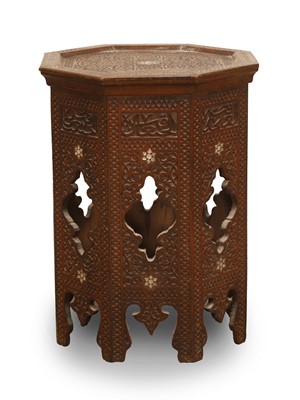 Lot 523 - An octagonal carved hardwood occasional table