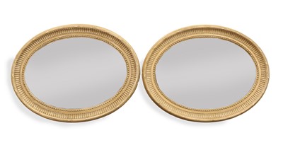 Lot 491 - A pair of OKA 'Killarney' oval painted wooden mirrors