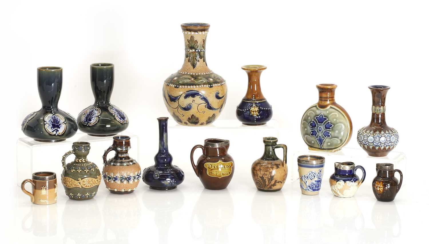 Lot 103 - A collection of miniature stoneware items