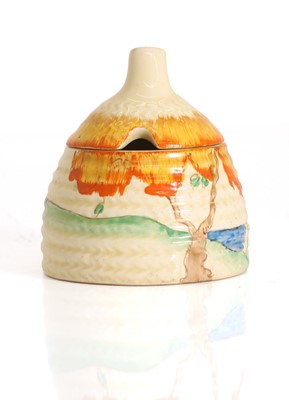 Lot 101 - A Clarice Cliff 'Taromina Orange' honey pot and cover