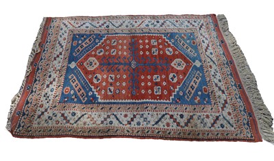 Lot 427 - A hand knotted Kazak wool rug
