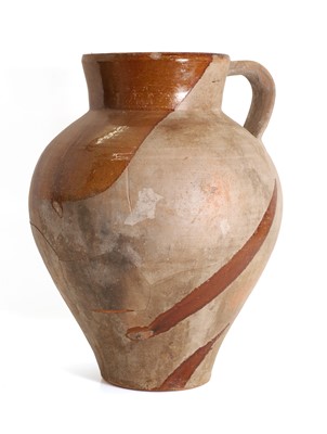 Lot 123 - A French terracotta semi glazed jug