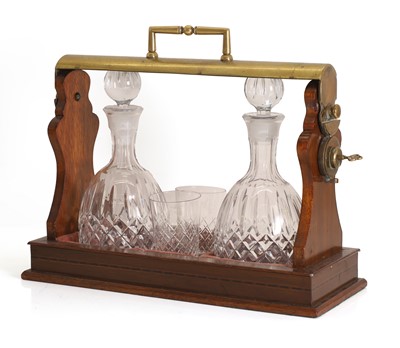 Lot 165 - A mahogany and brass tantulus