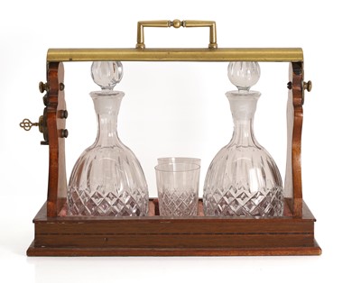 Lot 165 - A mahogany and brass tantulus