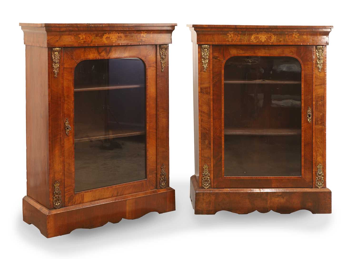 Lot 515 - A matched pair of Victorian inlaid walnut pier cabinets