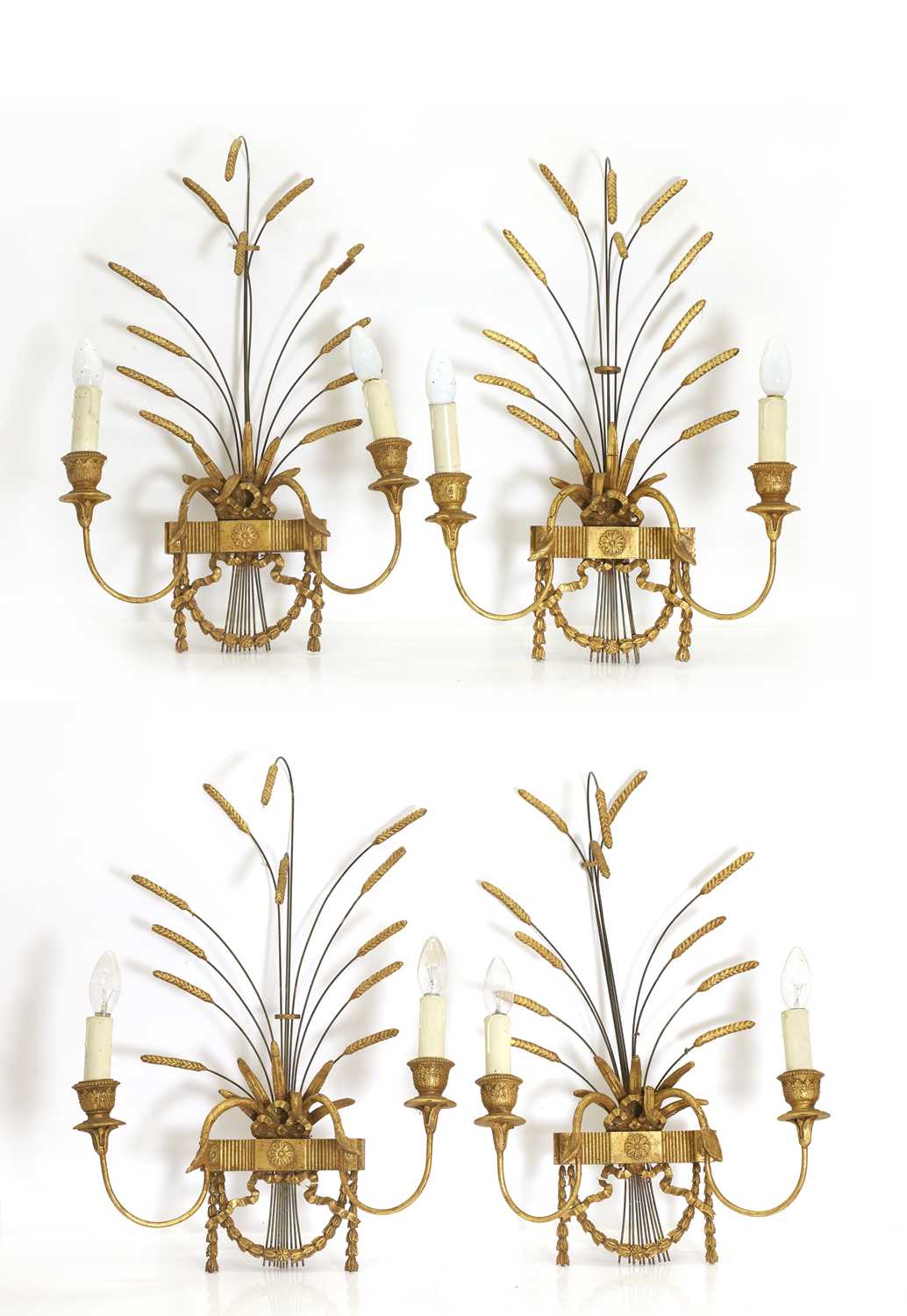 Lot 471 - A set of four gilt composition wall lights
